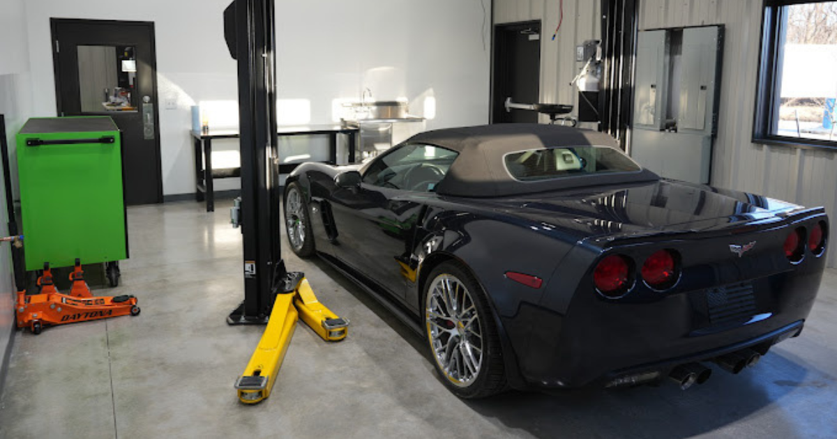 Black Corvette inside DIY garage bay with lift at Revvelation Motors in Lone Jack MO